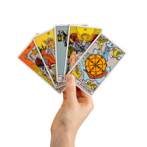 hand holding tarot cards, major arcana isolated on white background.